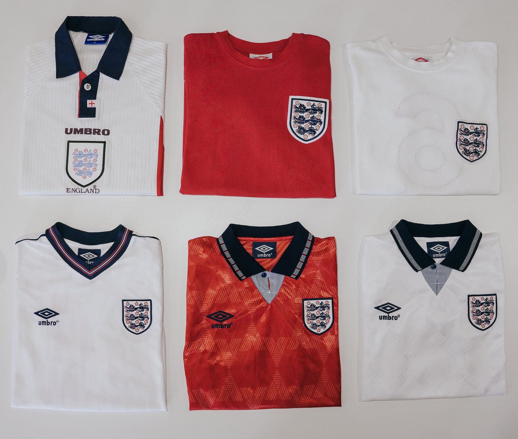 Six vintage England shirts laid out in two rows