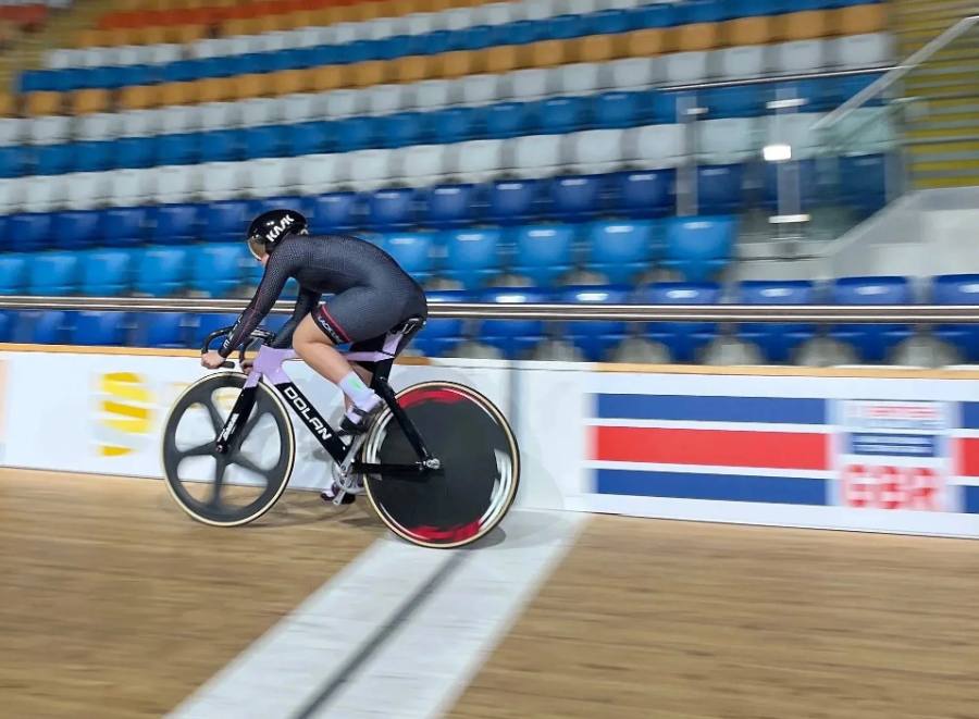 Track cyclist riding in a velodrome