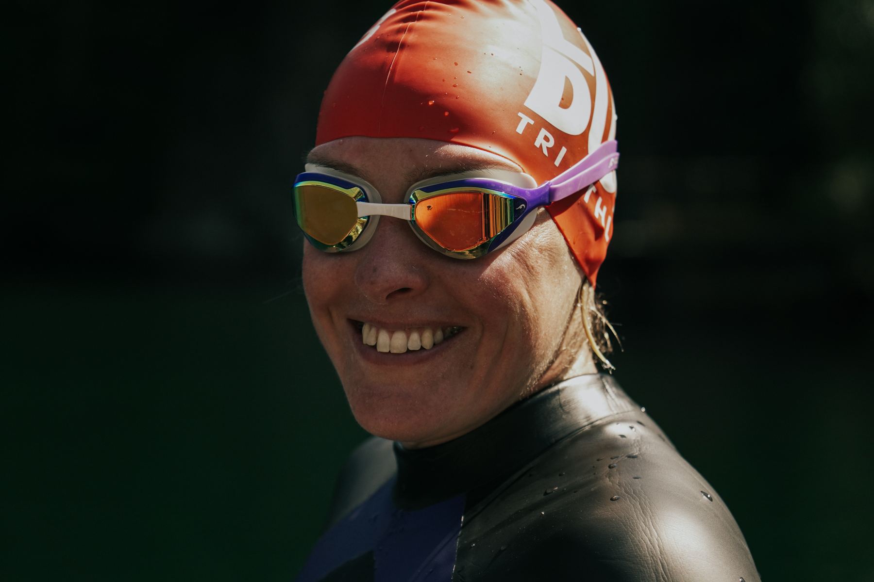 Dee Allen smiling in her swim cap and goggles