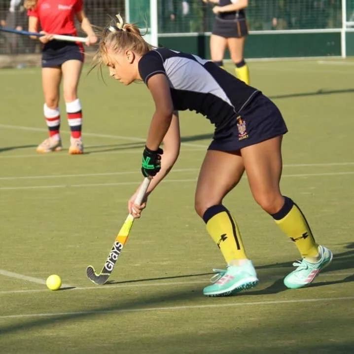 Holly playing hockey