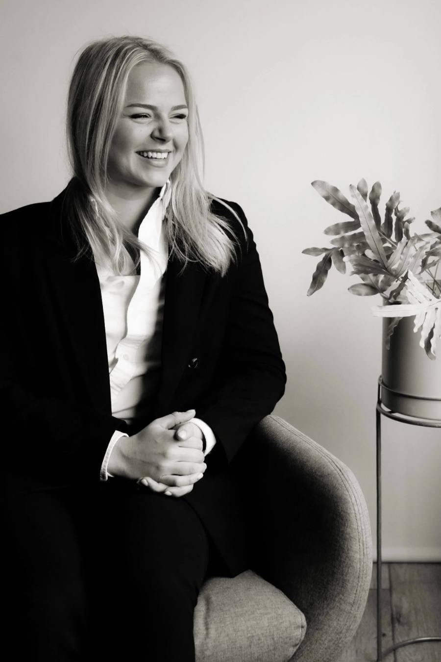 Holly James sitting in an armchair