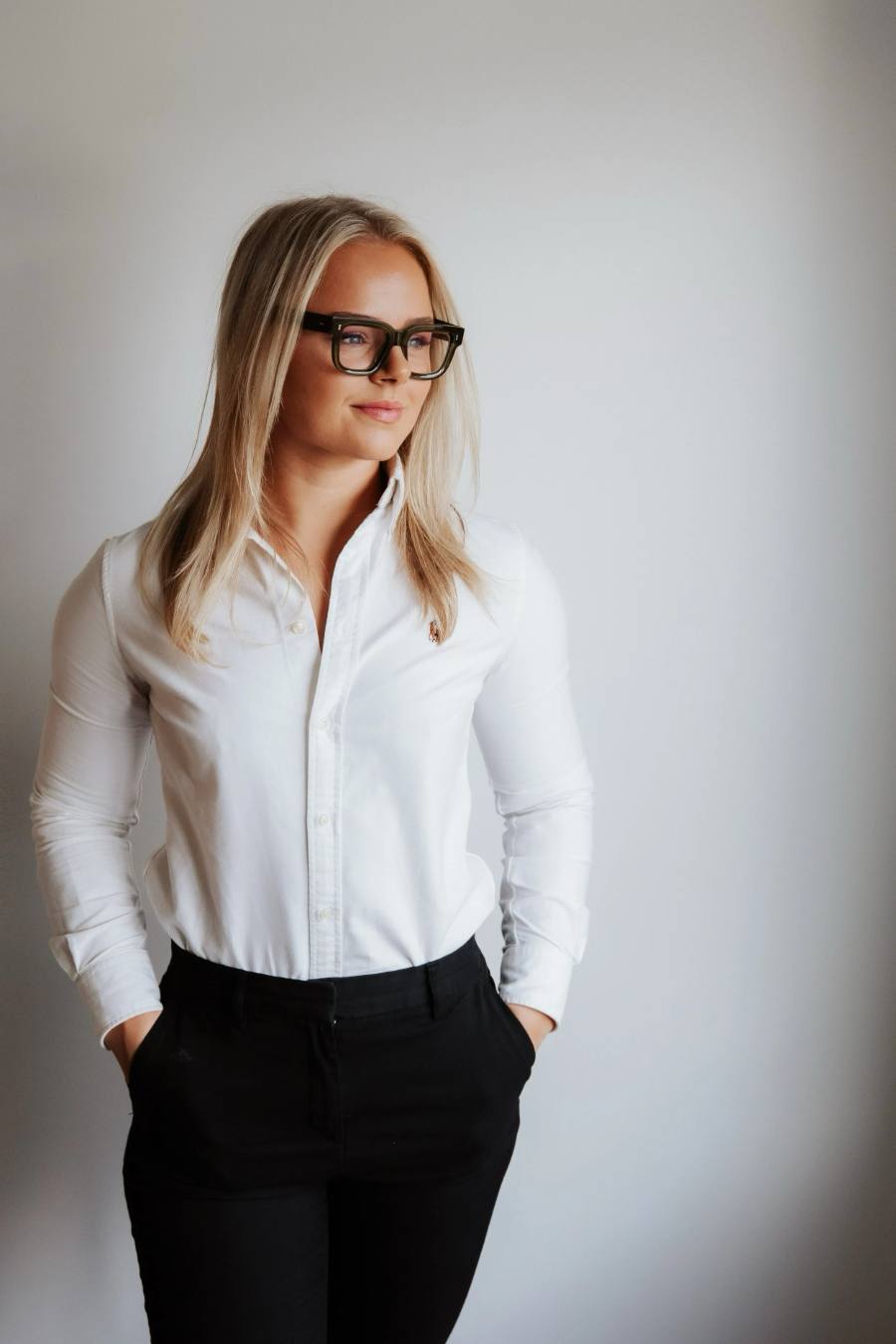 Holly James in glasses and a white shirt