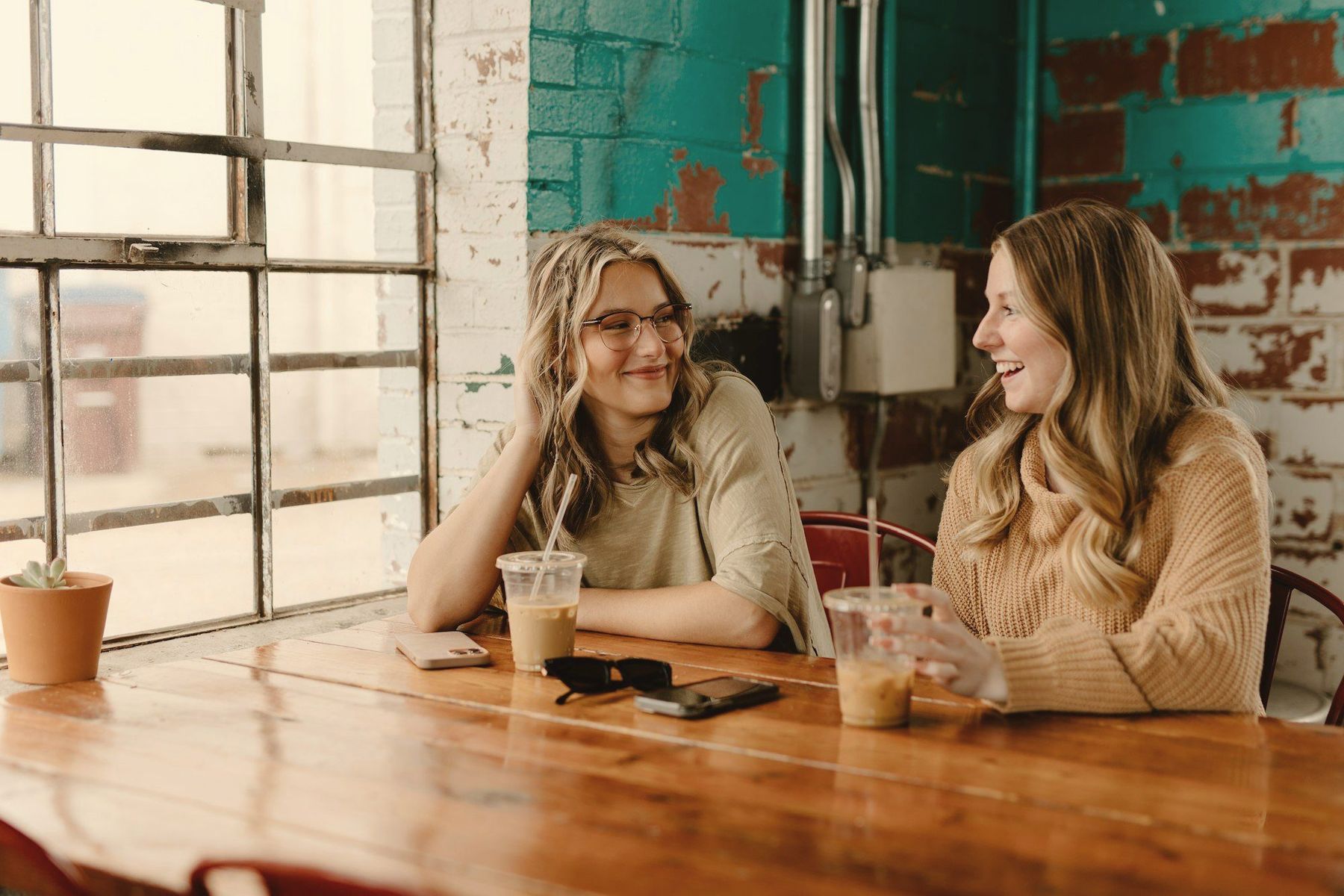 Two people talking over coffee